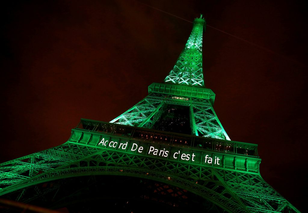 The Eiffel tower is illuminated in green with the words "Paris Agreement is Done", to celebrate the Paris U.N. COP21 Climate Change agreement in Paris, France, November 4, 2016. REUTERS/Jacky Naegelen/File Photo