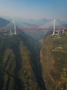 This picture taken on December 28, 2016 shows the Beipanjiang Bridge, near Bijie in southwest China's Guizhou province. The world's highest bridge has opened to traffic in China, connecting two southwestern provinces and reducing travel time by three quarters, local authorities said on December 30. / AFP PHOTO / STR / China OUT
