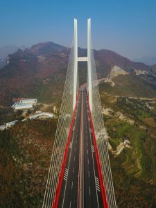 This picture taken on December 28, 2016 shows the Beipanjiang Bridge, near Bijie in southwest China's Guizhou province. The world's highest bridge has opened to traffic in China, connecting two southwestern provinces and reducing travel time by three quarters, local authorities said on December 30. / AFP PHOTO / STR / China OUT